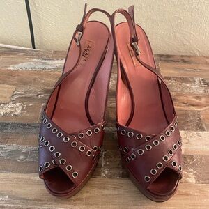 Alaia Eyelet Slingback Heels